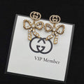 GUCCI GG BOW EARRINGS GOLD