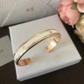 DIOR CODE BANGLE GOLD-FINISH METAL AND LACQUER WOMEN